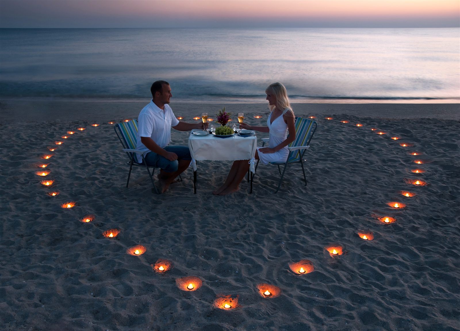A couple having a quiet dinner near the sea