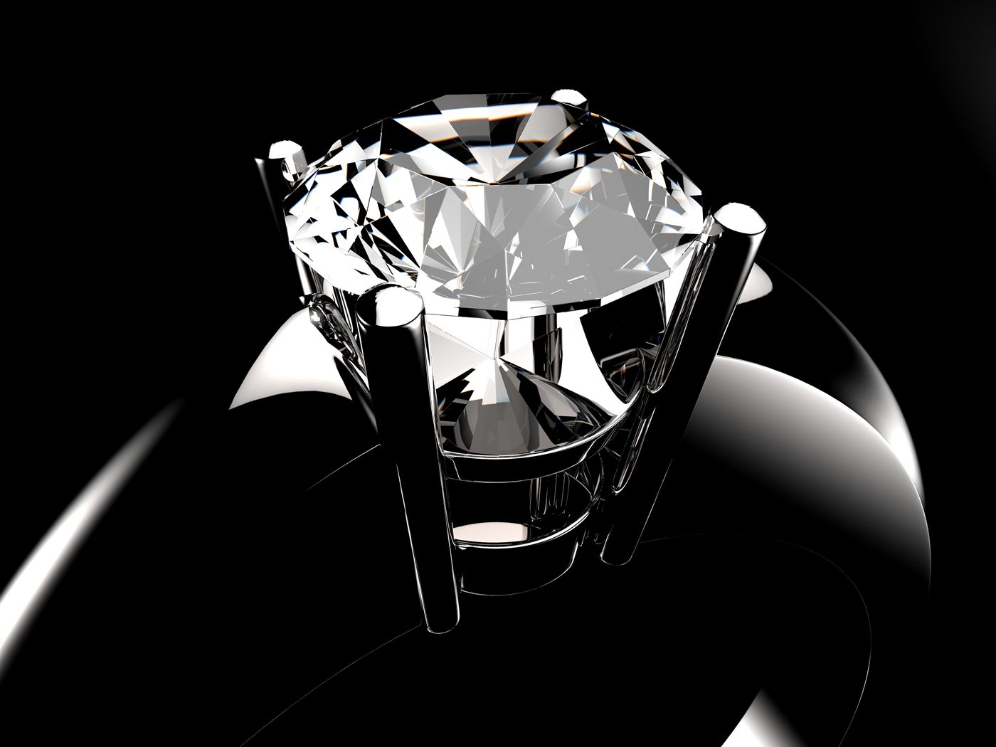 Close view of a round diamond held in a prong setting